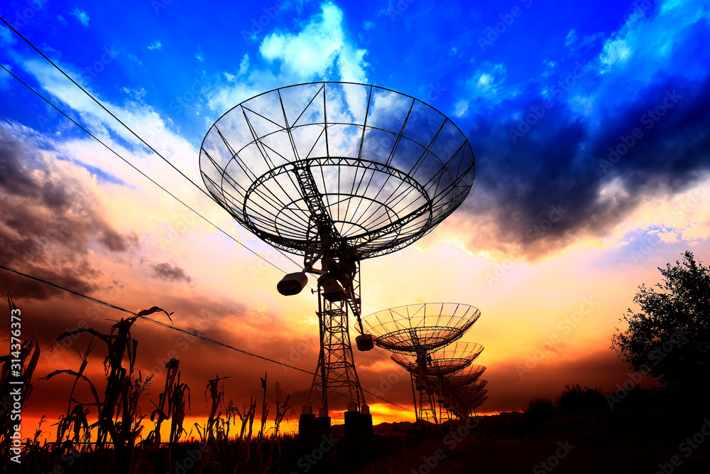 The silhouette of a radio telescope observatory The silhouette of a radio telescope observatory