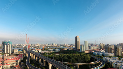 Panoramic view of Shanghai Yangpu bridge and cityscapes in sunny day, long time exposure landscape.