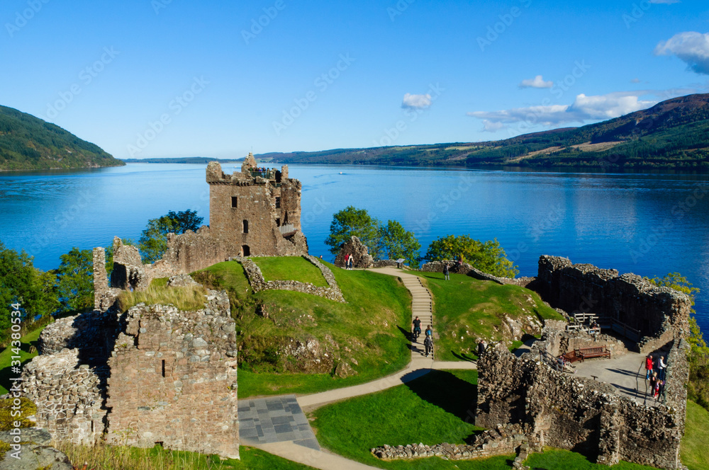 The ruins of Urquhart Castle on the shore of Loch Ness in Drumnadrochit,  Inverness, Scotland (Scottish Highlands) on a beautiful summer day Stock  Photo | Adobe Stock