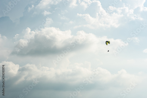 colorful paragliding over blue sky