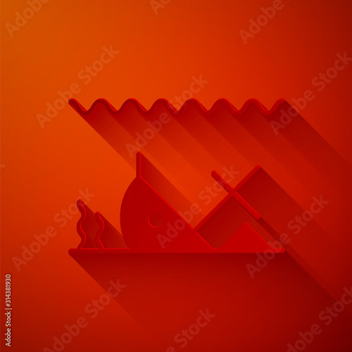 Paper cut Sunken ship at the bottom of the sea icon isolated on red background. Paper art style. Vector Illustration