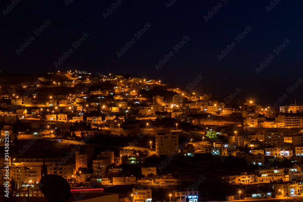 Fototapeta premium Night in Wadi Musa, town located near the archaeological site Petra, Jordan