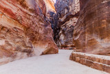The Siq, narrow gorge, main entrance to the ancient city Petra, Jordan