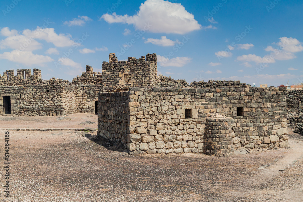 Ruined walls of Qasr al-Azraq (Blue Fortress), located in the desert of eastern Jordan.