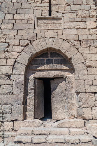 Stone door of Qasr al-Azraq  Blue Fortress   fortress located in the desert of eastern Jordan.