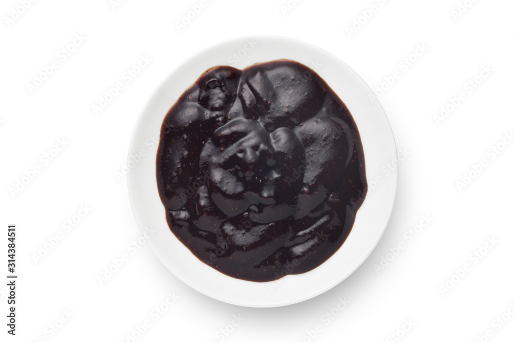 Black pepper sauce in a ceramics plate isolated on white background. Top view. Black pepper sauce in a ceramics plate isolated on white background. Top view.