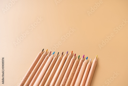 A colored pencil on a yellow background.