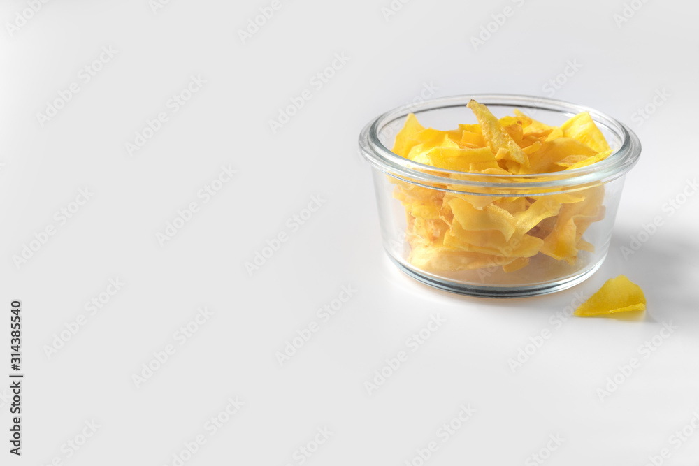 Organic jackfruit chips on paper background with copy space