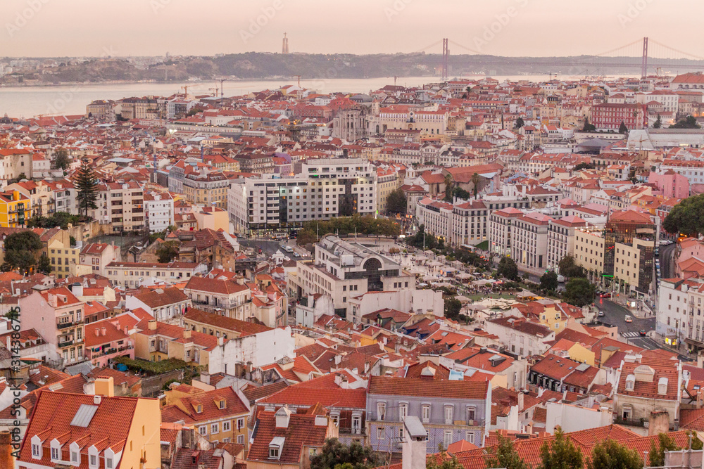 Panorama of evening Lisbon from Miradouro da Graca viewpoint, Portugal