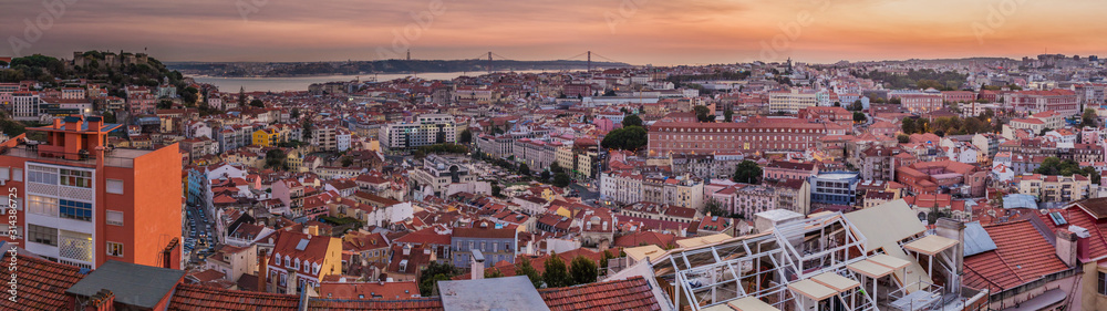 Panorama of evening Lisbon from Miradouro da Graca viewpoint, Portugal