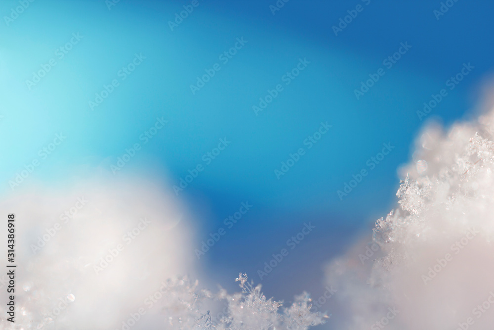 Background from real ice crystals in blue and turquoise shades in macro with copy space for your text. Christmas, New Year, winter frame with a border of natural ice crystals close-up. Background from real ice crystals in blue and turquoise shades in macro with copy space for your text. Christmas, New Year, winter frame with a border of natural ice crystals close-up.