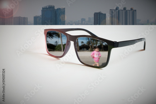 Work-Life-Balance: An abstract illustration of the modern way of life that must be considered in the balance of time and work.By reflecting of the travel destination image through the lens of glasses 