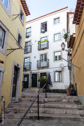 Narrow alley in Alfama neighborhood of Lisbon, Portugal