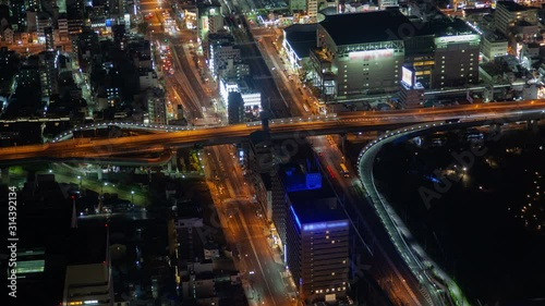 Wallpaper Mural Timelapse Osaka illuminated downtown with heavy traffic highways and crossing overpass motorway with city rail at night Torontodigital.ca