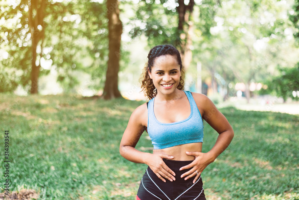 Fit black beautiful woman standing and looking to you Fit black beautiful woman standing and looking to you