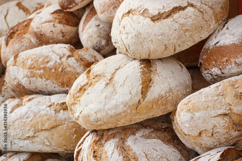 Fresh loaves of rye or wheat bread