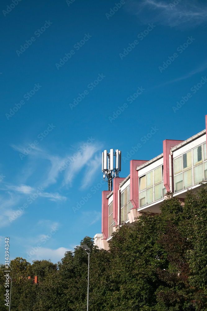 Telecommunication cellular base station on a building