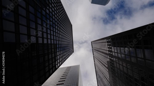 Looking up view of skyscrapers in Manhattan New York City . Modern offices and apartments in NYC. Concept of American urban life, business work lifestyle.