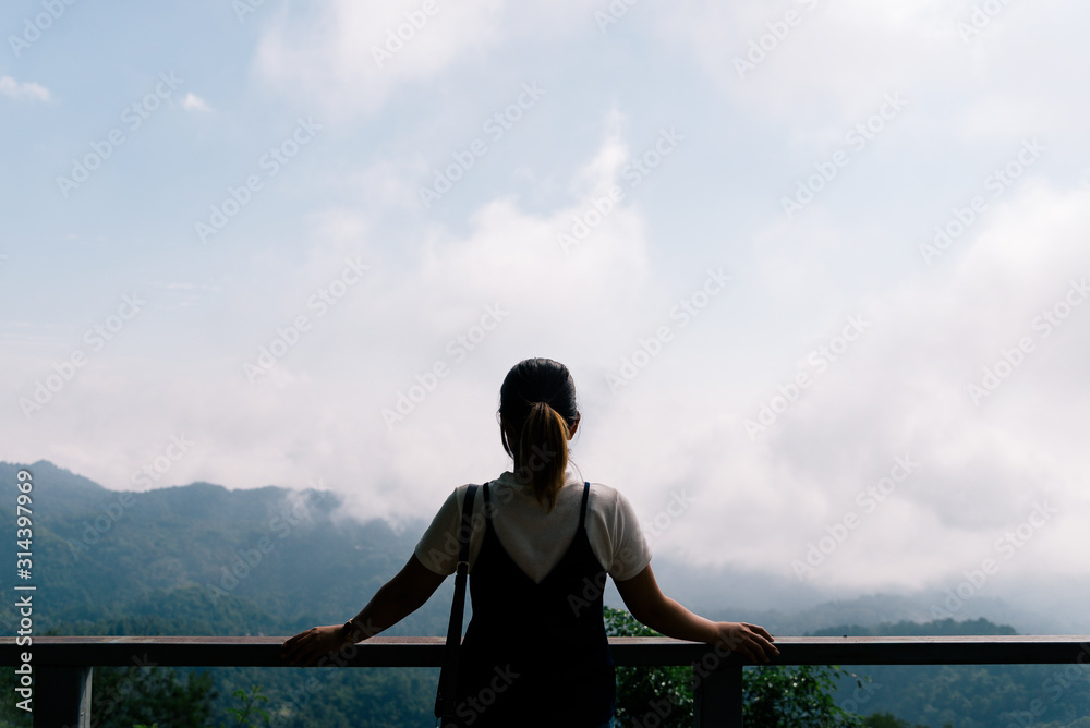 woman looking up to the mountain travel concept woman looking up to the mountain travel concept