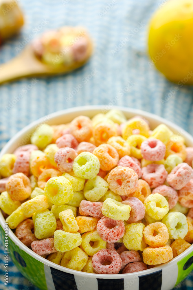 Cereal flakes in bowl with copy space,Breakfast concept.Food with delicious fruity taste and fruity colours.It's made with maize,wheat,and barley