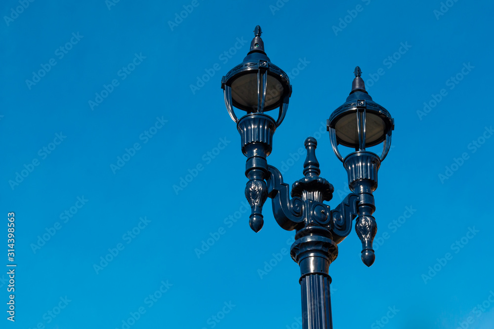 A vintage street lamp in an urban city.