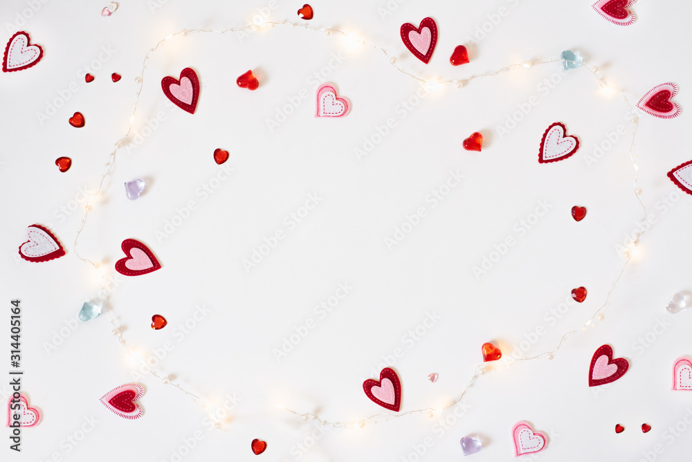 The background of Valentine's day. Frame from a Variety of different hearts and sparks on white background