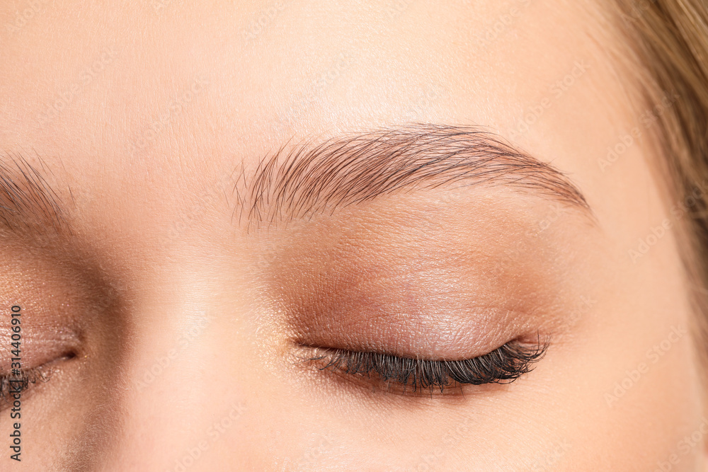 Fototapeta premium Young woman with beautiful eyebrows, closeup