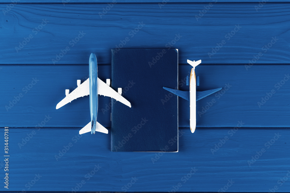 Toy plane on classic blue background, top view - obrazy, fototapety, plakaty 
