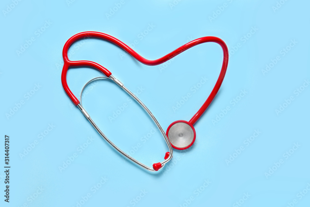 Modern stethoscope on color background Modern stethoscope on color background