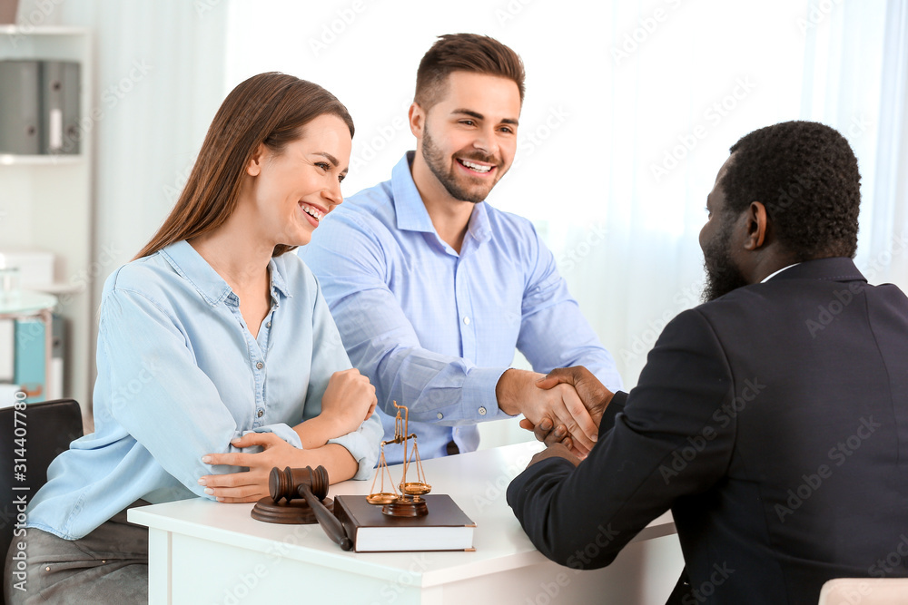 Couple visiting lawyer in office Couple visiting lawyer in office