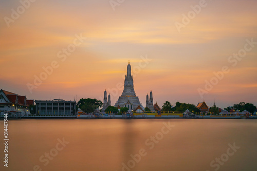 The most beautiful Viewpoint, Wat Arun Ratchawaram Ratchaworamawihan at sunset twilight sky, Bangkok,Thailand © Naypong Studio