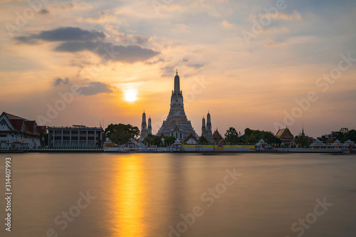 The most beautiful Viewpoint, Wat Arun Ratchawaram Ratchaworamawihan at sunset twilight sky, Bangkok,Thailand © Naypong Studio