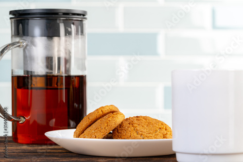 Tea served on a wooden kitchen table