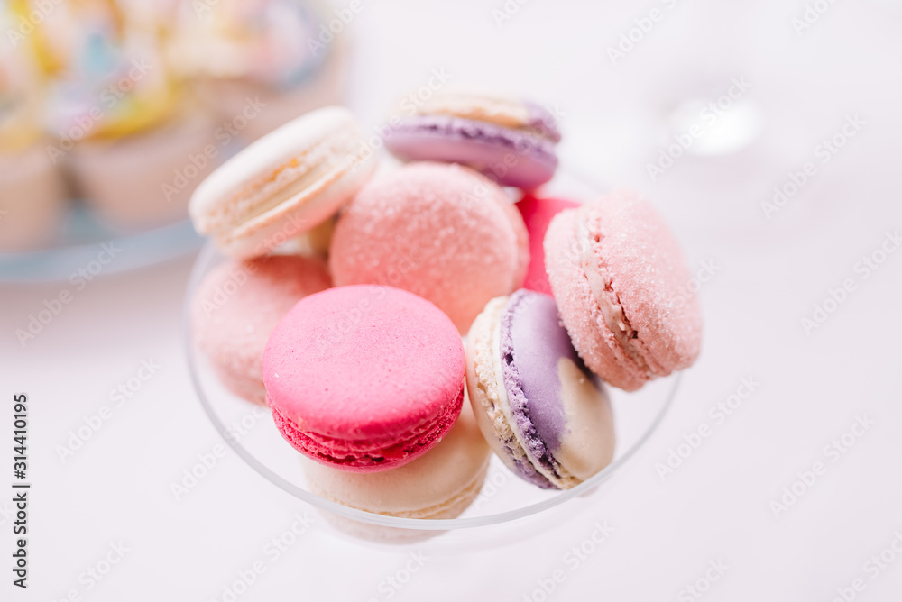 Colorful macaroons. Sweet macarons on light background with copy space. Top view, Holiday time concept Colorful macaroons. Sweet macarons on light background with copy space. Top view, Holiday time concept