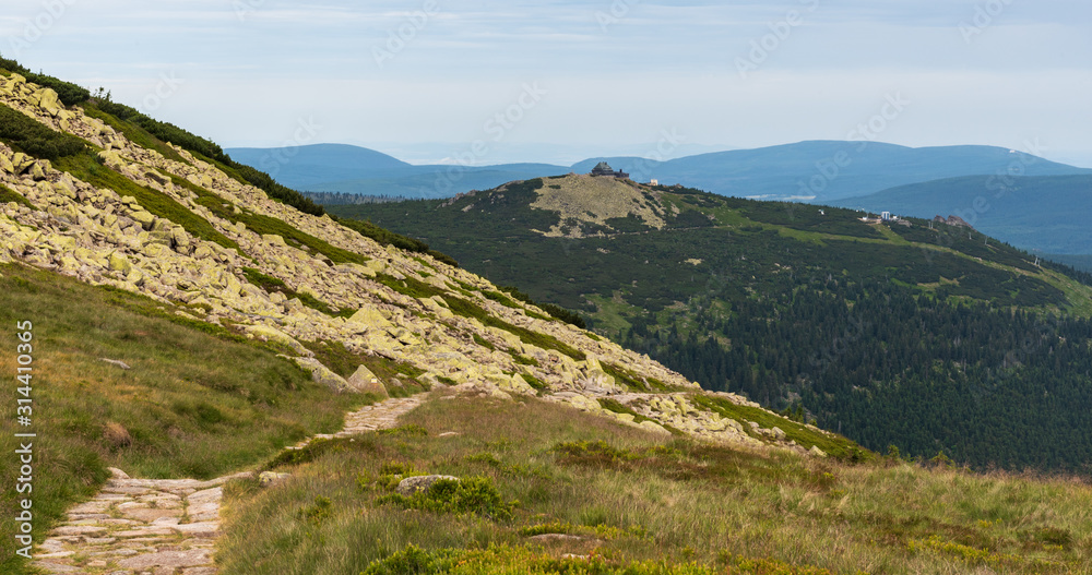 Szrenica hill with Gory Izerskie mountains on the background from hiking trail bellow Labsky Szczyt hill in Karkonosze mountains in Poland