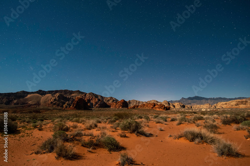 USA, Nevada, Clark County, Gold Butte National Monument. A view of the night sky with stars over Bitter Ridge with Virgin Peak in the Distance.