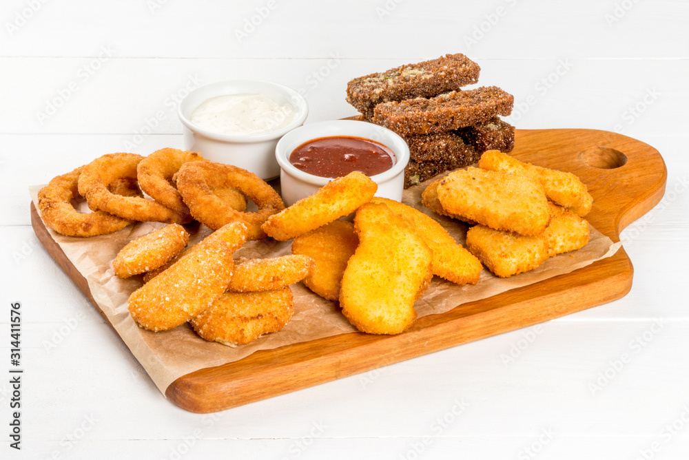Beer plate with appetizer of croutons, chicken, sauces Beer plate with appetizer of croutons, chicken, sauces