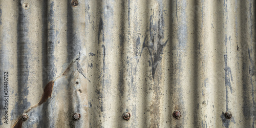Abstract background grunge metal corrugated iron with scratches and rust. Rough textured old weathered rustic backdrop