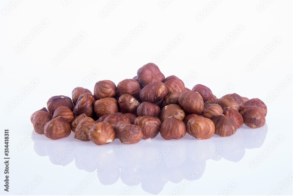 nuts or hazelnuts nuts on a background new. nuts or hazelnuts nuts on a background new.