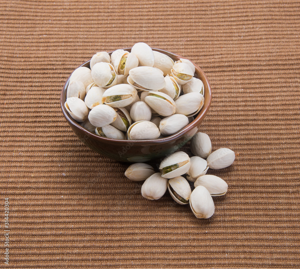 nuts or pistachios nuts on a background new. nuts or pistachios nuts on a background new.