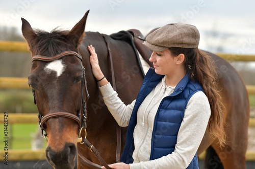 Portrait of horsewoman and horse © goodluz