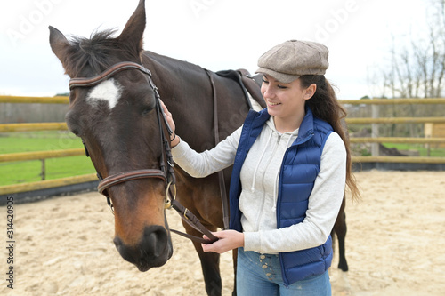 Portrait of horsewoman and horse