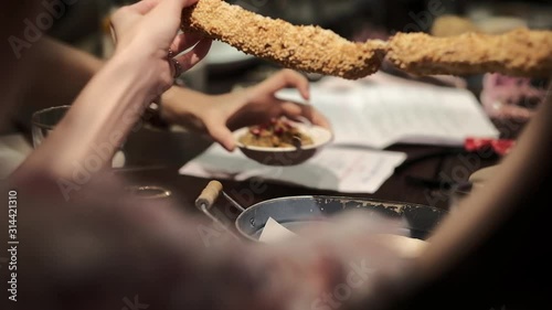 People having dinner at table and Shred bread. eating dinner and leisure concept