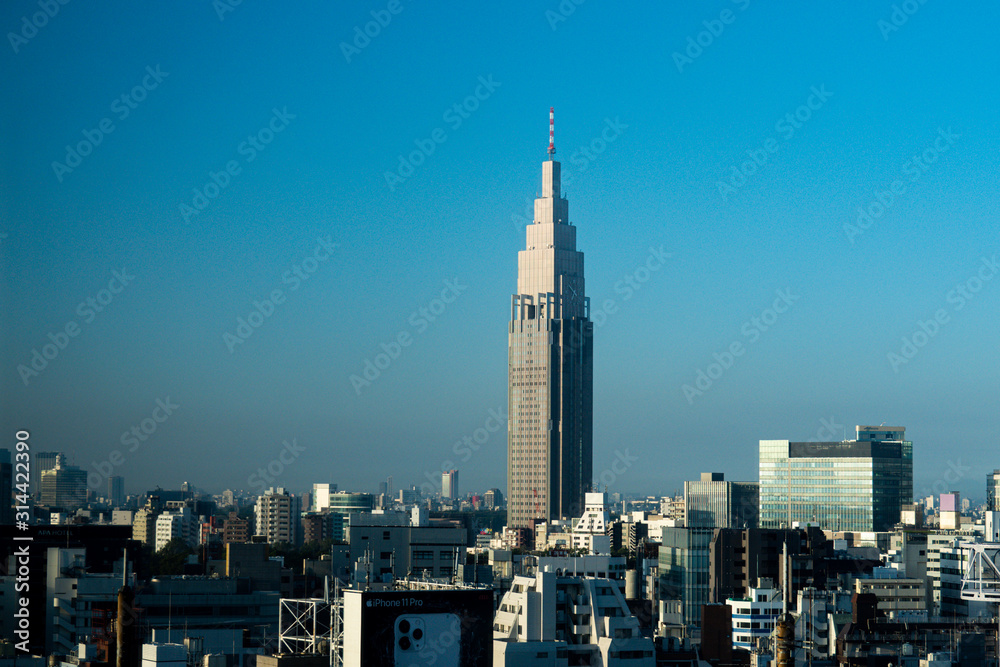 Japan / Tokyo - October 30 2019:  NTT DOCOMO Yoyogi Building with sky in the morning. Japan city urbanscape real estate.