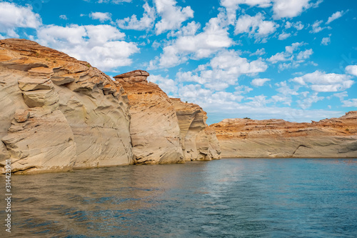 View of narrow, cliff-lined canyon from a boat in Glen Canyon National Recreation Area, Lake Powell, Arizona.