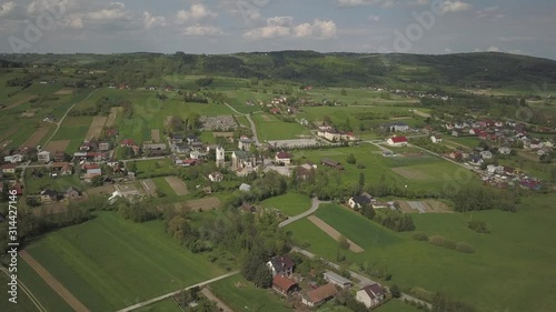 Biezdziadka, Poland - 4 9 2019: Panorama from a bird's eye view. Central Europe: The Polish village of Kolaczyce is located among the green hills. Temperate climate. Flight drones or quadrocopter. photo