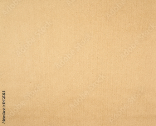 texture of smooth brown kraft wrapping paper, full frame