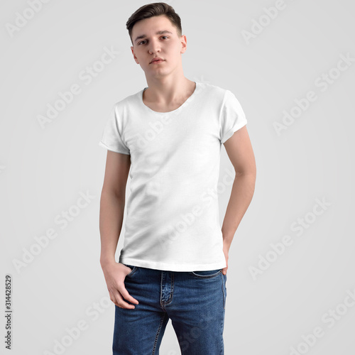 Mockup of men's t-shirt on a young guy in blue jeans, front view.