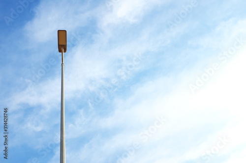 A street light on a blue sky