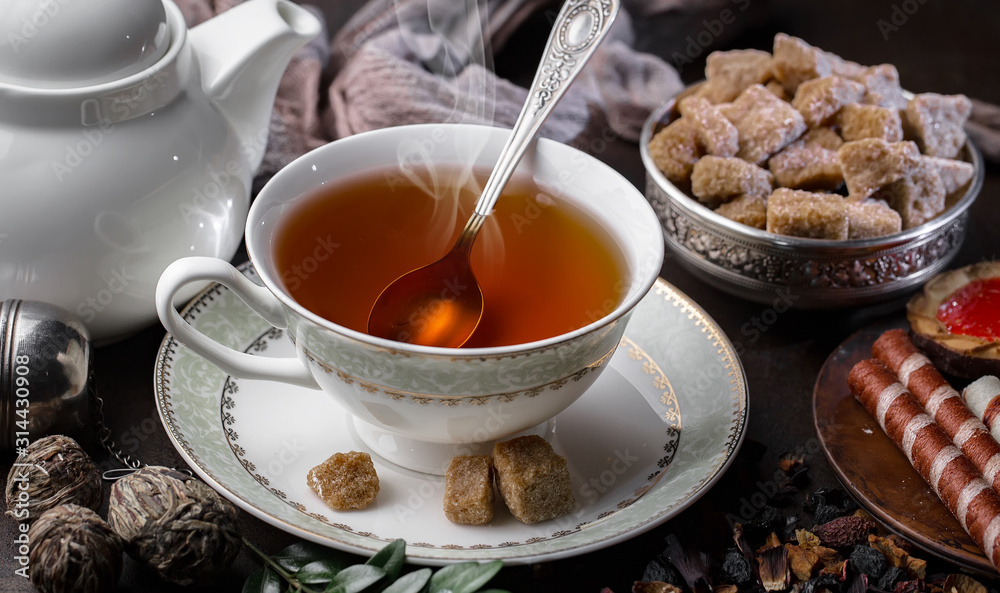 Tea hot drink on old background in composition on the table Tea hot drink on old background in composition on the table